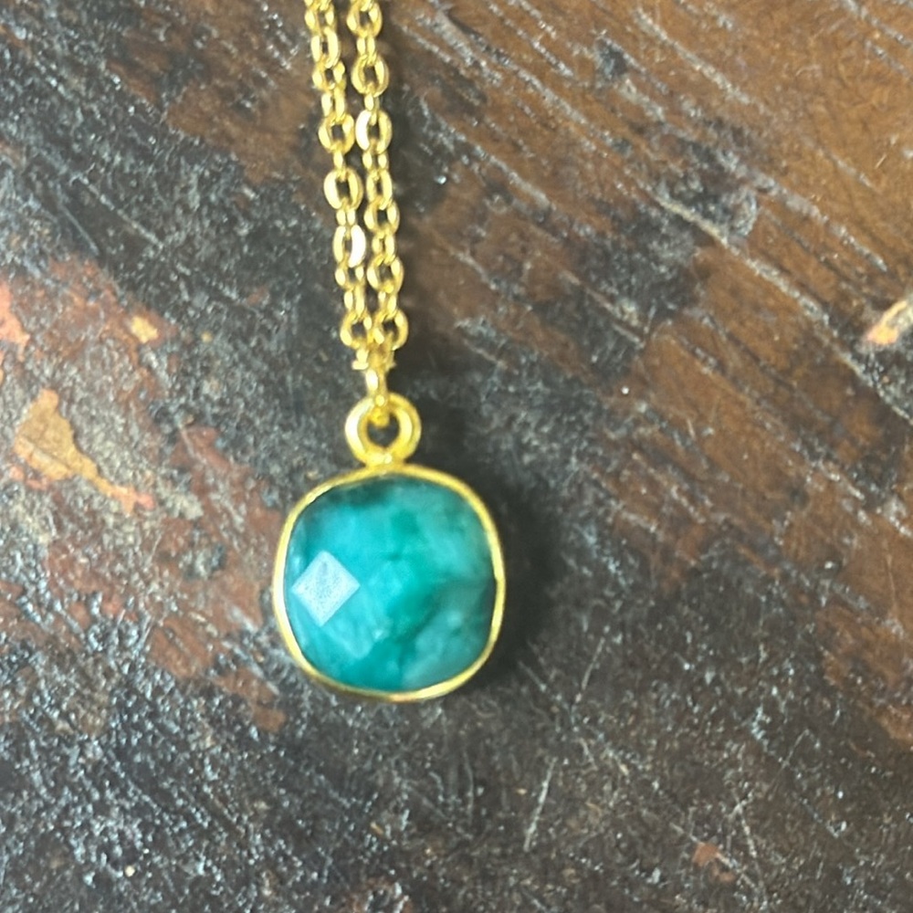 Sundance charm bezeled emerald on sterling silver gold plated chain.